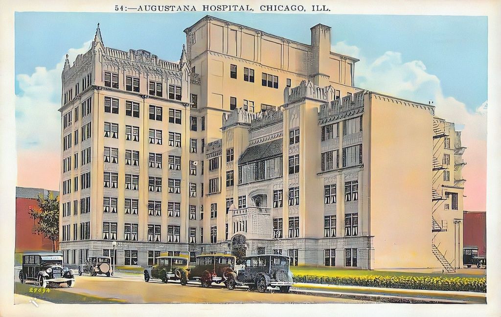 Color-enhanced postcard from the 1920s depicting Augustana Hospital in Chicago, Illinois. The hospital is a multi-story building with a detailed Gothic architecture, featuring ornate window arches and a grand entrance. The foreground shows several vintage cars parked along the curved driveway, indicative of the era. The hospital's facade is elaborately decorated with sculptural details and stands prominently against a clear sky. This image captures the essence of early 20th-century medical facilities in urban settings.